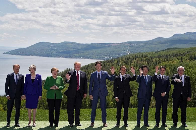 From left: European Council President Donald Tusk, British Prime Minister Theresa May, German Chancellor Angela Merkel, US President Donald Trump, Canadian Prime Minister Justin Trudeau, French President Emmanuel Macron, Japanese Prime Minister Shinz