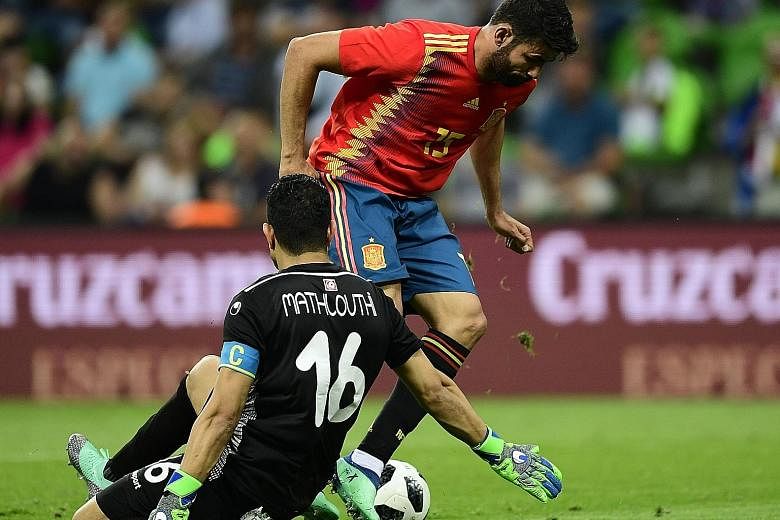Spain's Diego Costa getting past Tunisia's goalkeeper Aymen Mathlouthi. The Atletico Madrid forward set up Iago Aspas' winner and was a nuisance for the Africans' defenders on Saturday.