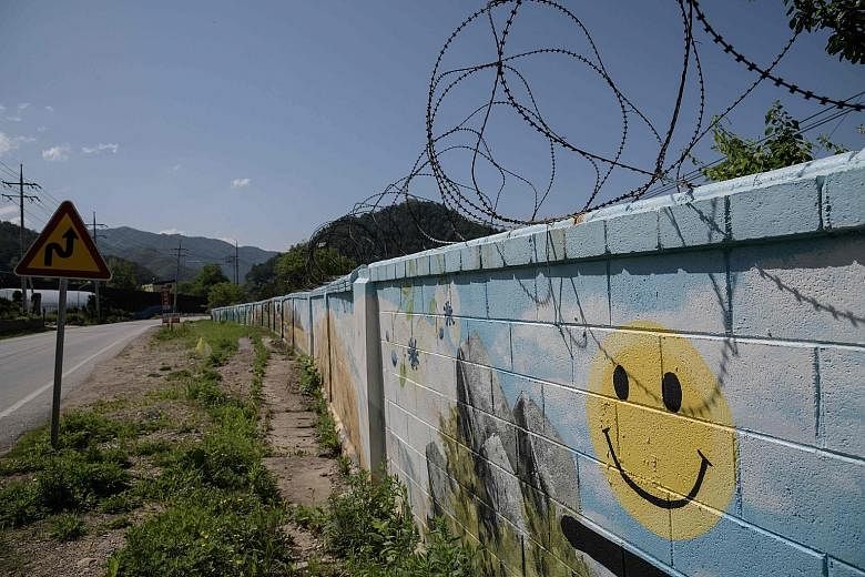 The wall of a military camp close to Haean-myeon, near the Demilitarised Zone separating North and South Korea. If a peace treaty is reached to end the Korean War, the forces ranged along the DMZ could gradually be scaled back and that might eventual
