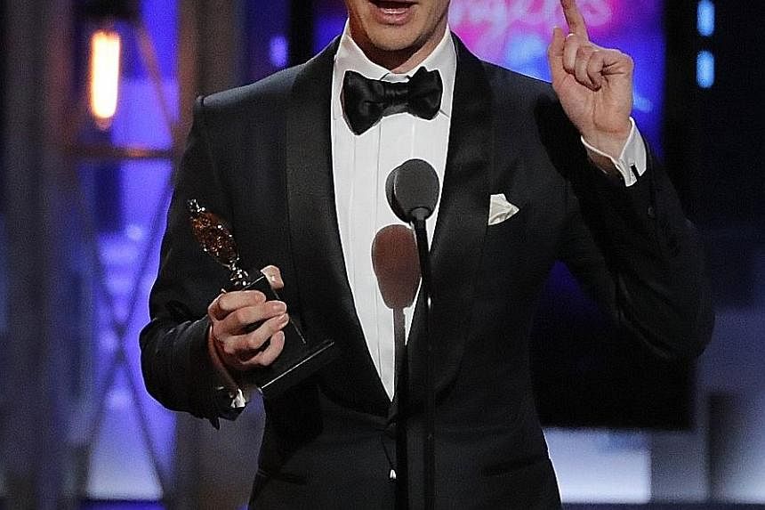 (Above) Andrew Garfield wins best actor in a play for Angels In America; and British actress Glenda Jackson was named best actress in a play for Three Tall Women.