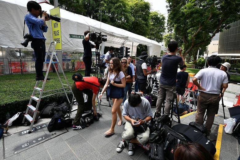 Media members yesterday staking out Tanglin Place, opposite The St Regis Singapore, where North Korean leader Kim Jong Un is staying.