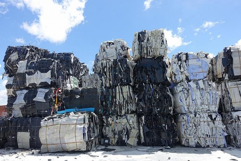 As China bans the import of more types of solid waste, there is growing fear that the hazardous materials would find their way into other parts of the region. Tonnes of old electronic products piled up inside a factory compound in Samut Prakan provin