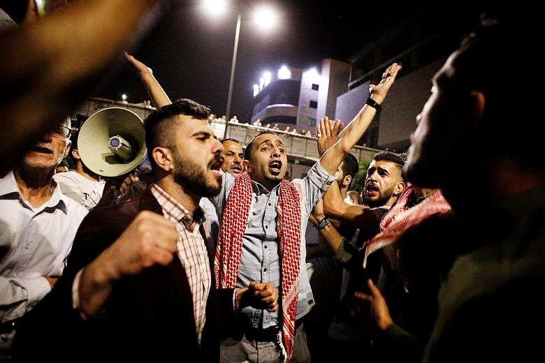 Austerity measures tied to an International Monetary Fund loan have seen prices of basic necessities rise across Jordan, leading to angry protests in cities including Amman (left) over tax proposals that forced prime minister Hani Mulki to resign las