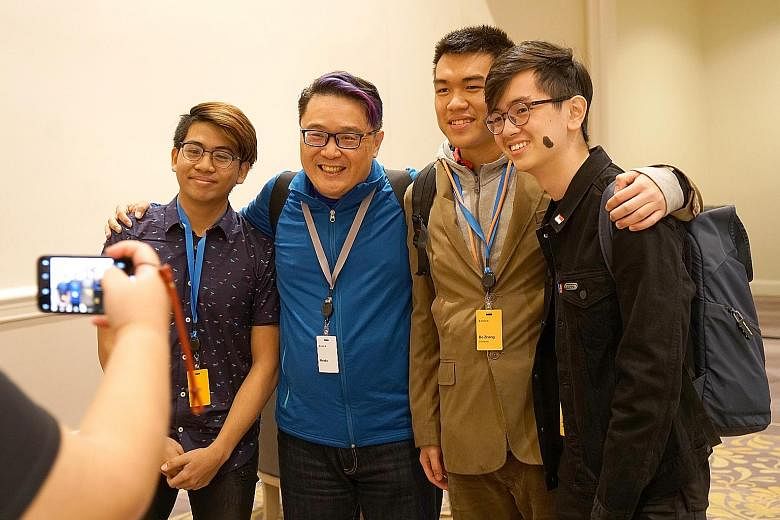 Singapore blogger Mr Brown (in blue) with (from left) young developers Dalton Ng, Zhang Bozheng and James Lim, who attended the Worldwide Developers Conference (WWDC) under Apple's WWDC Scholarships scheme.