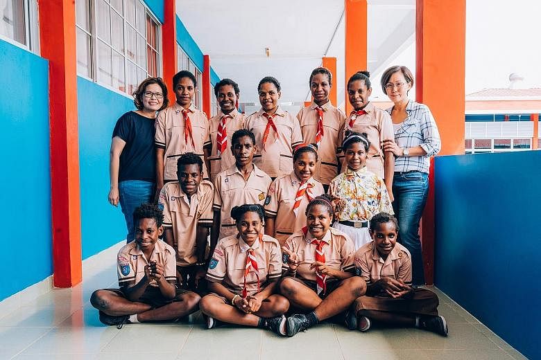 Madam Sheela Zee (left) and Madam Nicole Ng with some of the children from Mentari Dunia orphanage in Batam. The home has 15 children from Indonesia's Papua province - 12 girls and three boys aged 10 to 14.