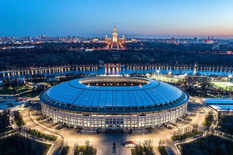 An aerial view of Moscow taken with a drone shows a lit-up Luzhniki Stadium, which will host both the World Cup opener and final, with the main building of the Moscow State University in the background.