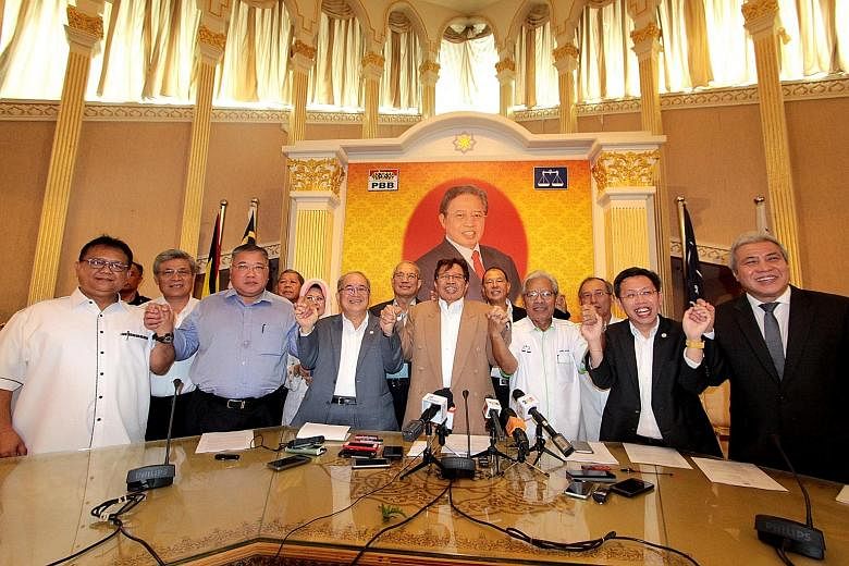 Leaders of the four Sarawak parties that have decided to leave BN include PBB president Abang Johari Tun Openg (centre, in brown jacket), PBB deputy president Douglas Uggah Embas (in grey jacket), and PRS president James Masing (in white shirt).