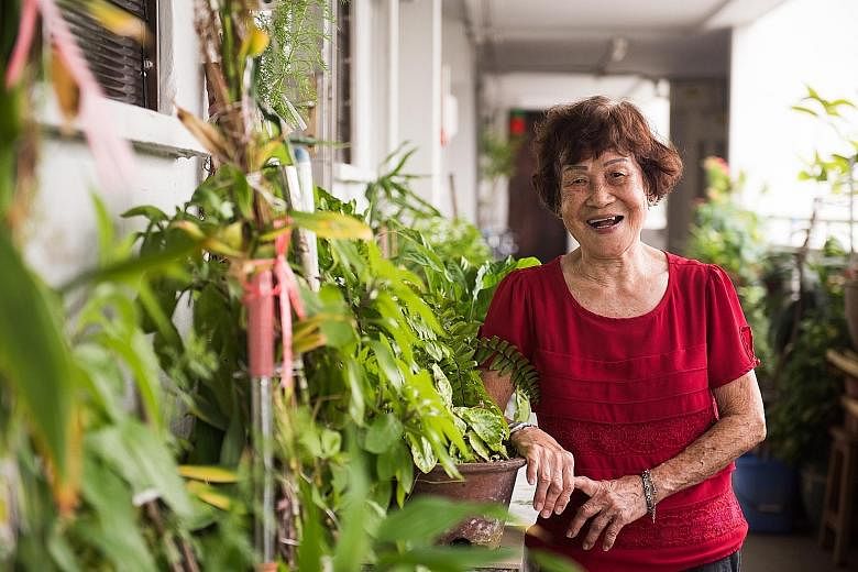 Madam Kok Yoon Hin, 86, outside her HDB flat. The octogenarian is today the oldest volunteer at the Touch Senior Activity Centre in Geylang Bahru.