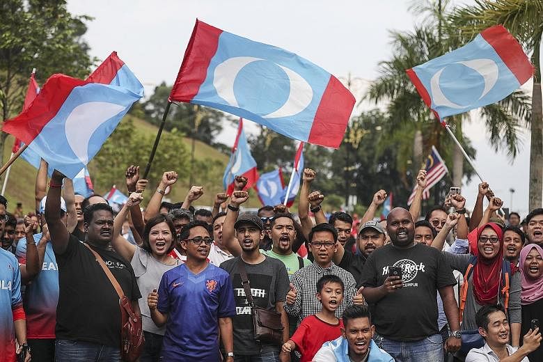 Supporters of Tun Dr Mahathir Mohamad in Kuala Lumpur on May 10. The Pakatan Harapan (PH) alliance secured a historic win in last month's general election. Analysts and politicians say the three-way split in Malay support - divided between Barisan Na
