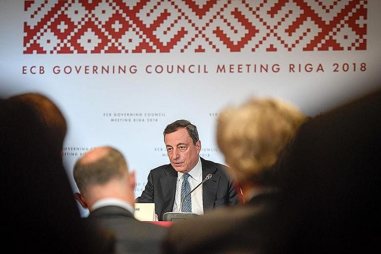 European Central Bank president Mario Draghi at a press conference following the meeting of the bank's governing council in Riga, Latvia, yesterday.
