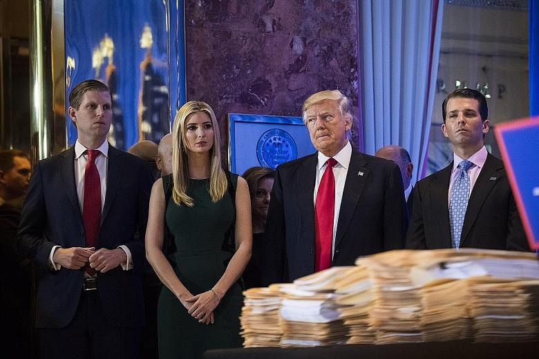 The lawsuit filed against the Donald J. Trump Foundation seeks to bar US President Donald Trump (third from left) and his children (from left) Eric, Ivanka and Donald Jr from serving on non-profit organisations.