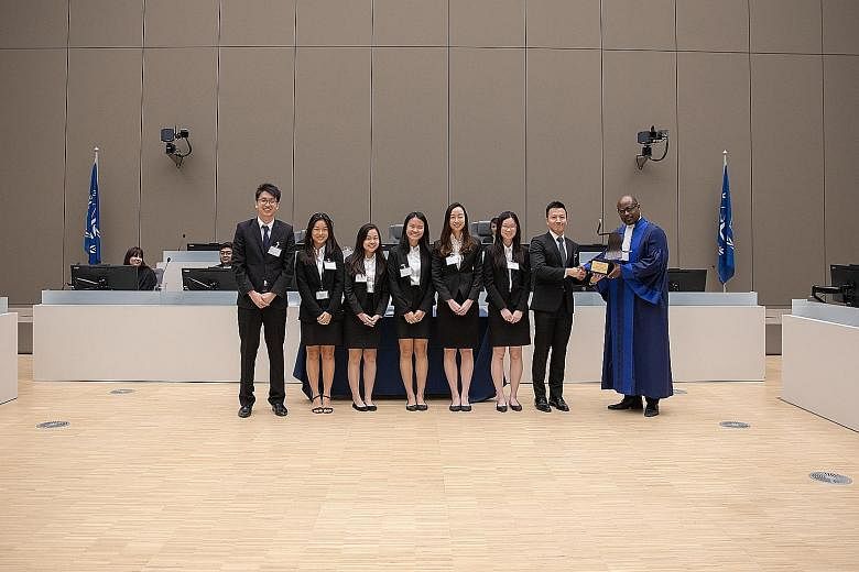 (From far left) SMU team members Sampson Lim, Ilene Chua, Tessa Tan Si Ying, Tracy Gani, Yu Zheng Yi, Ng Pei Qi and Lee Chuan with ICC judge Geoffrey A. Henderson. They beat top student teams from across the globe to win the competition.
