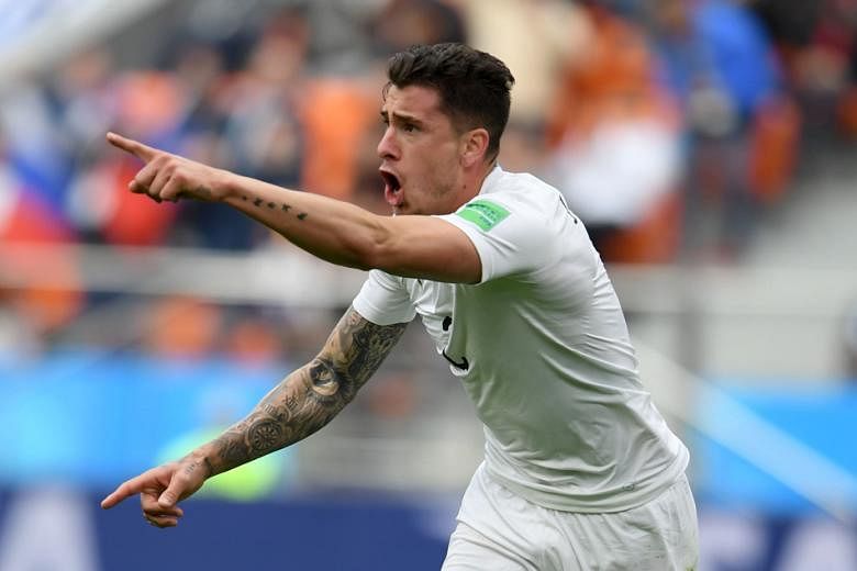 Uruguay's defender Jose Gimenez celebrates scoring the opening goal during the Russia 2018 World Cup Group