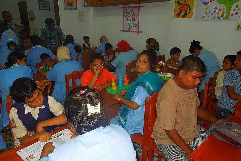 At the Unique Gift Foundation's school in Saidpur, Bangladesh, teachers provide support and assess the specific needs of the autistic child they are assigned to in one-on-one sessions.