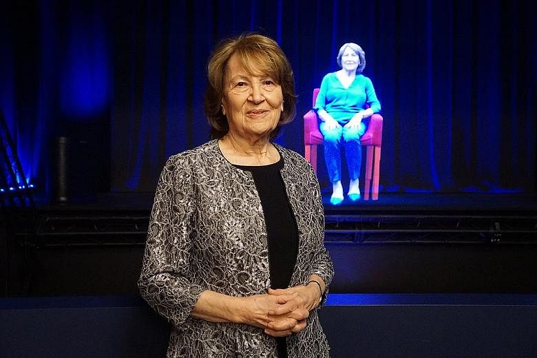 Above: Ms Fritzie Fritzshall, president of the Illinois Holocaust Museum and Education Centre, in front of her hologram.