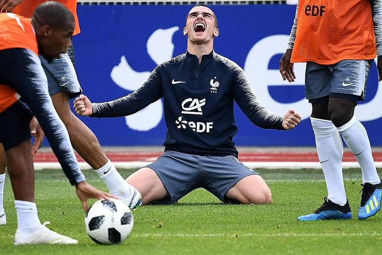 Antoine Griezmann celebrating a goal during a training session with France ahead of their World Cup opener against Australia. Atletico Madrid supporters may look forward to more of the same, after the French forward turned down a move to Barcelona.