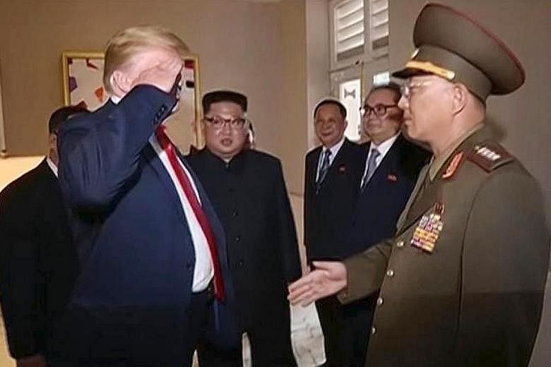 US President Donald Trump saluting North Korean defence chief No Kwang Chol, with North Korean leader Kim Jong Un also present.