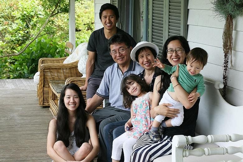 Ms Eileen Kwong, who was adopted when she was a month old, with her husband Roger Kwong, their three children and two grandchildren. A bizarre incident that happened when she was 19 inspired her to start this search.