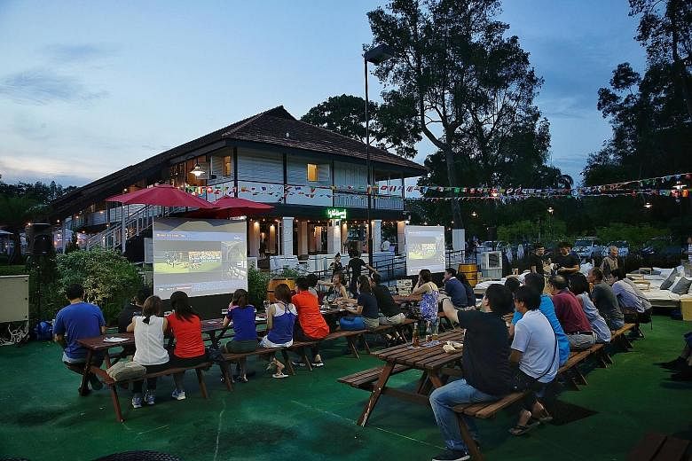 Straits Times subscribers and their friends watching the match between Australia and France at Wildseed Cafe and Bar yesterday.