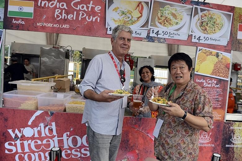 The late television host Anthony Bourdain with Makansutra founder K.F. Seetoh at the Food Jamboree at the World Street Food Congress in 2013.