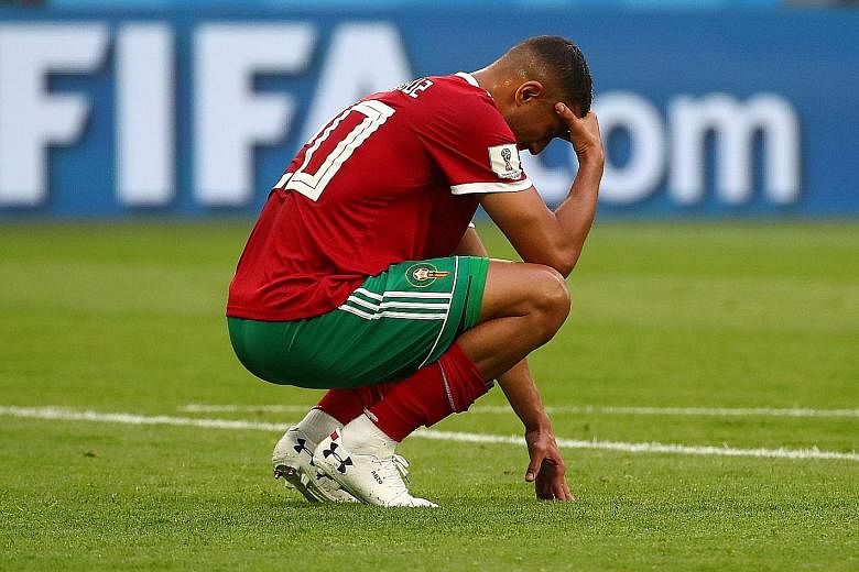 A dejected Morocco forward Aziz Bouhaddouz after their 1-0 loss to Iran on Friday, no thanks to his own goal deep in added time in St Petersburg. Iran forward Reza Ghoochannejhad commiserated with him on Instagram, saying: "We are all professional sp