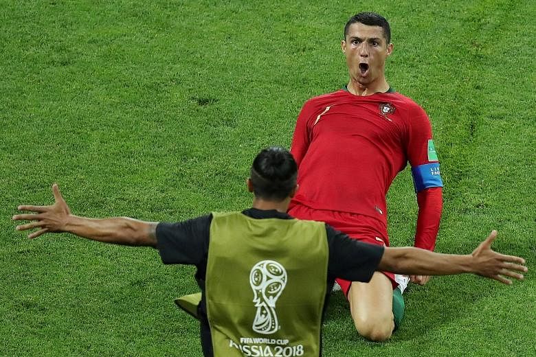 Cristiano Ronaldo celebrates scoring Portugal's second goal. He goes on to score their third with a free-kick in the 88th minute to deny Spain victory.