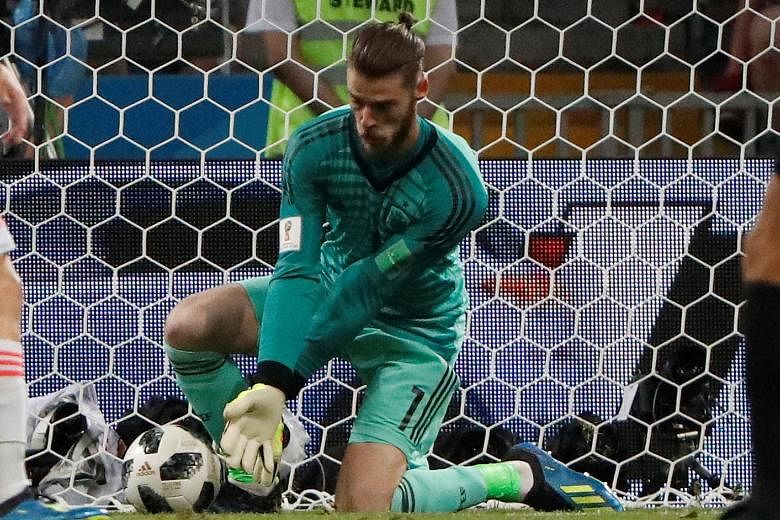 Spain goalkeeper David de Gea fumbles the ball from a Cristiano Ronaldo shot which allowed Portugal to go 2-1 up during the Group B match on Friday.