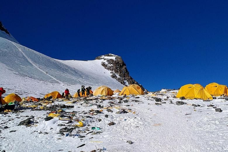 Discarded climbing equipment and rubbish scattered around Camp 4 of Mount Everest, in a photo taken last month. With the number of commercial climbers soaring, the waste problem has only worsened.