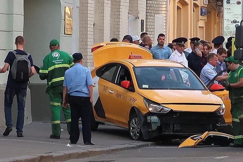 The cab mounted a pavement in central Moscow on Saturday, injuring at least seven people on the third day of the Fifa World Cup.