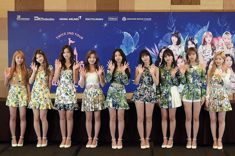 Members of the band Twice - comprising (from left) Chaeyoung, Sana, Tzuyu, Jihyo, Nayeon, Momo, Mina, Jeongyeon and Dahyun - say they are fans of Singapore's chilli and black pepper crab.