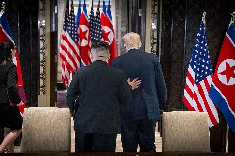A conflicted South Korea is trying to digest everything thrown at it from the June 12 Singapore summit between US President Donald Trump (far right) and North Korean leader Kim Jong Un, says the writer.
