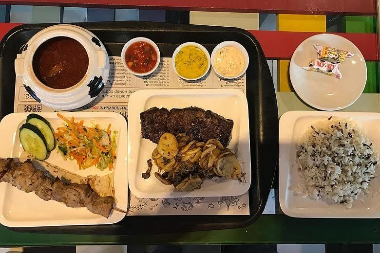 The burgers are good but Straits Times correspondent David Lee also tries a horse-meat kolbasa sandwich offered by Luda and Katia from Tula. Shashlik – skewered, grilled meat – was a hit with the writer. The My-My stolovaya is a Soviet-style canteen that 