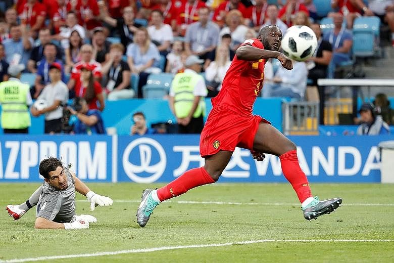 Romelu Lukaku deftly lifting the ball over Panama goalkeeper Jaime Penedo to score Belgium's third and seal a 3-0 win over the World Cup debutants. The striker had earlier scored Belgium's second after Dries Mertens had opened accounts for the 2014 q