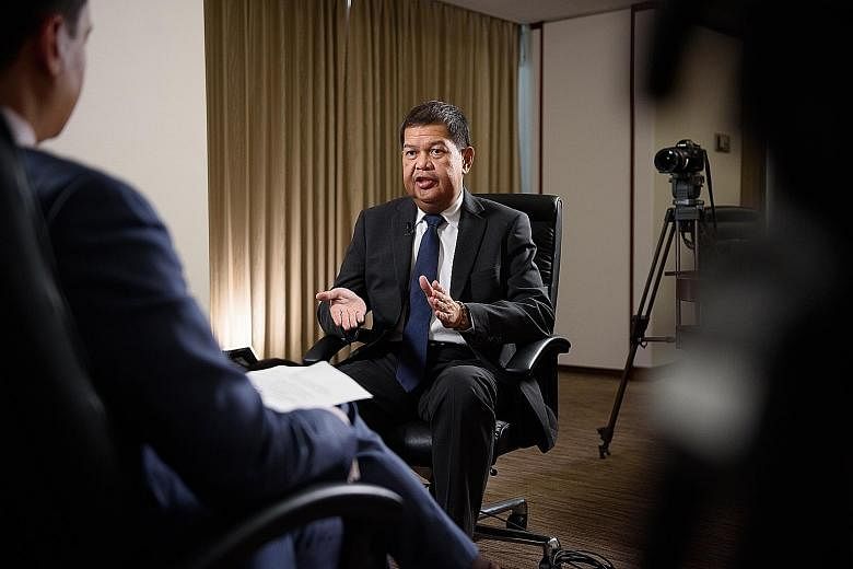 Philippine central bank governor Nestor Espenilla giving an interview in Tokyo yesterday. He has said the peso's movements have been market-driven, and the currency continues to draw support from the country's healthy macroeconomic fundamentals. But 