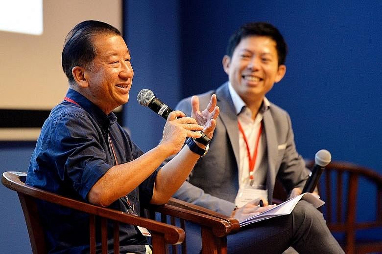 Mr Gerard Ee, executive director of Beyond Social Services, with IPS research fellow Justin Lee as the moderator, during the question-and-answer session at the Community Forum yesterday. Mr Ee, who was the keynote speaker, touched on the theme of the