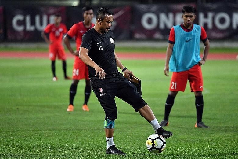 Singapore's U-23 team coach Fandi Ahmad at a training session in Bishan Stadium last night. The former international feels the match against Myanmar is an opportunity for his players to showcase their talent to the people.