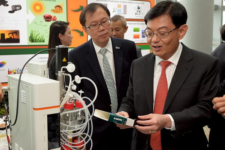 Finance Minister Heng Swee Keat (right) with Professor Ho Teck Hua, senior deputy president and provost of National University of Singapore, at the launch of WIL@NUS Corporate Laboratory.
