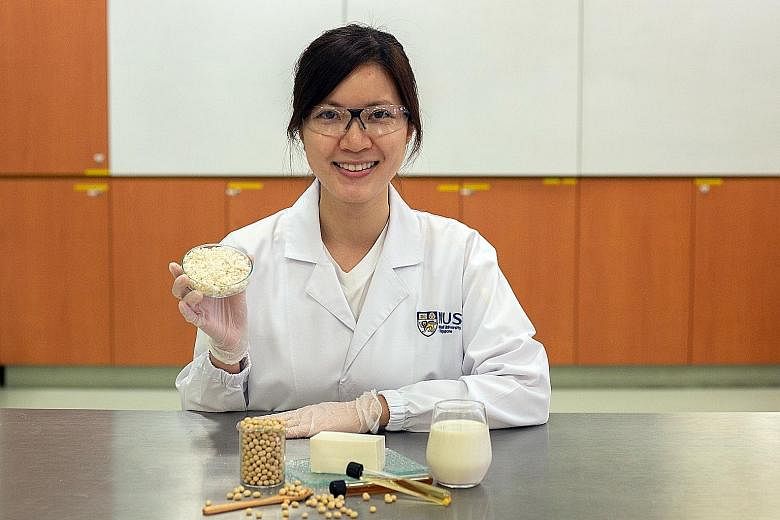 PhD student Miss Vong Weng Chan holding a dish with the enhanced okara.