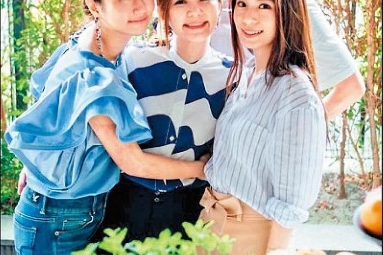 Taiwanese pop group S.H.E may not have performed together for some time, but members of the group (Selina Jen, left, and Hebe Tien, right) gathered on Monday to celebrate Ella Chen's (centre) 37th birthday with her husband, Malaysian businessman Alvi