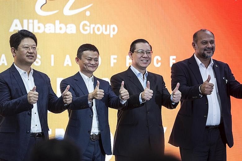(From left) China's Ambassador to Malaysia Bai Tian, Alibaba founder Jack Ma, Malaysian Finance Minister Lim Guan Eng and Malaysian Communications and Multimedia Minister Gobind Singh Deo at the opening of Alibaba Group's office in Kuala Lumpur on Mo