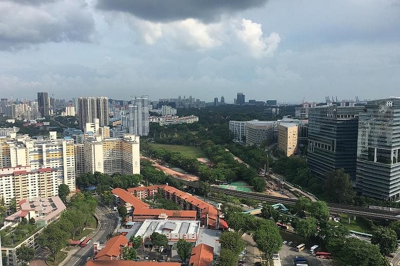 Above: The five-room HDB resale flat sold for $1.1 million is on the 38th floor of Block 18C in Holland Drive. Left: The view from the 38th floor of Block 18C.