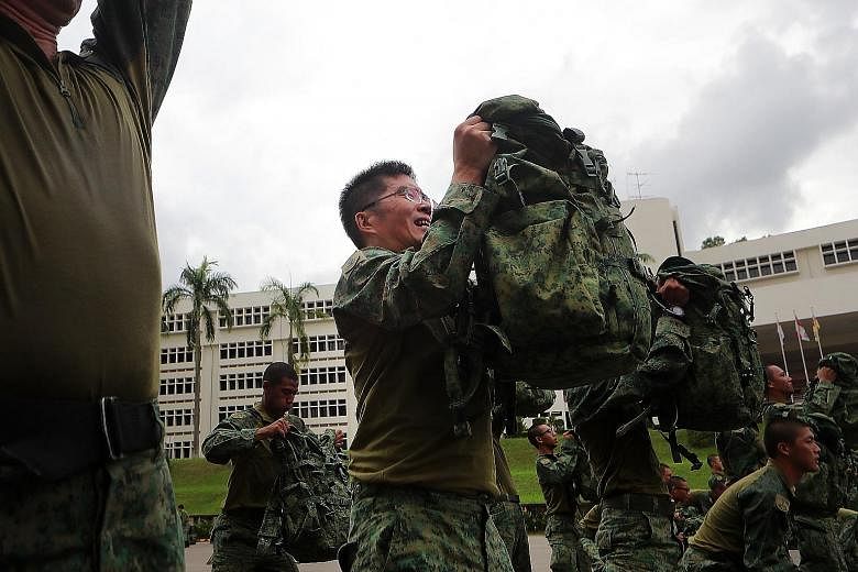 Major-General Melvyn Ong, the Chief of Defence Force, training with the soldiers while wearing the new hybrid uniform. The hybrid uniform will be worn during outfield exercises and combat physical training. For other routine activities such as parade