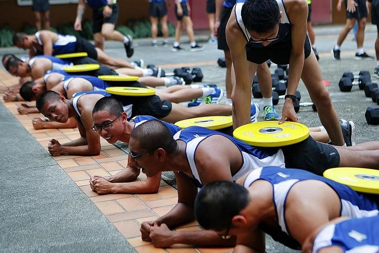 Soldiers from 4th Battalion, Singapore Infantry Regiment (4 SIR), in the customised Vocation Fitness Training programme at Bukit Panjang Camp.