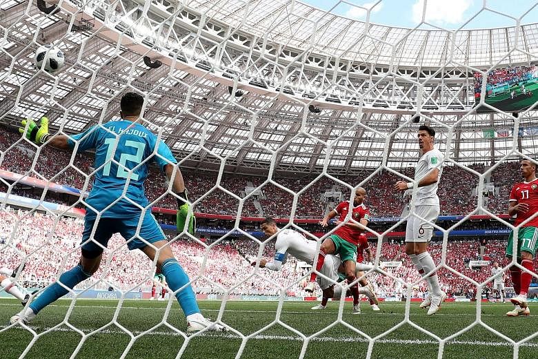 Portugal captain Cristiano Ronaldo (second from left, in white) scored with a powerful header in the fourth minute at the Luzhniki Stadium in Moscow to earn his team a 1-0 win over fellow Group B rival Morocco. It was his fourth goal at the Russia Wo