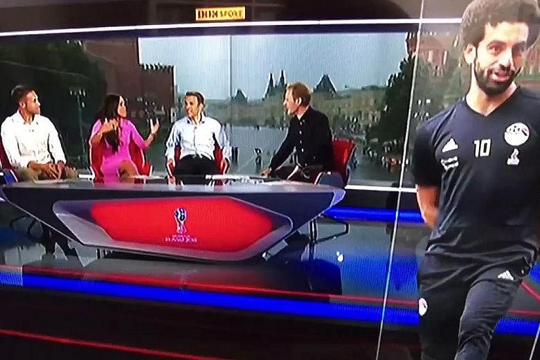 SAY WHAT? "I don't really know if you heard any of that with the torrential rain but... thanks for watching." BBC's Dan Walker sees the funny side of the rain drowning out the presentation of its World Cup show in a less-than-soundproof studio. WATCH