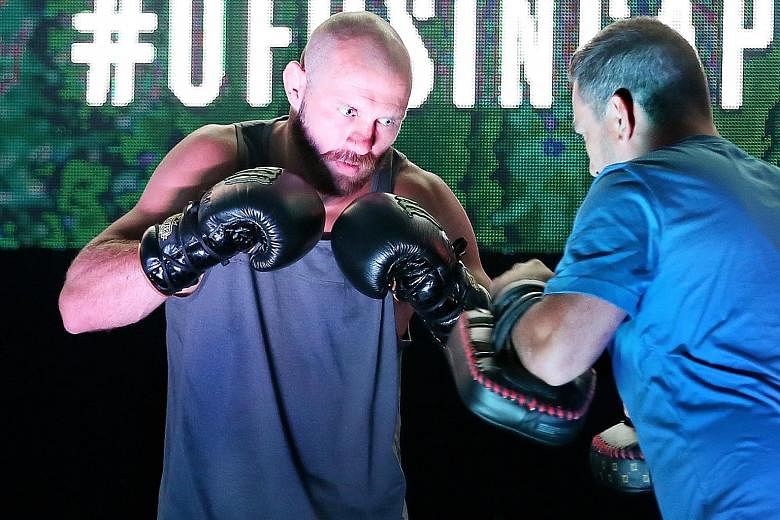 Donald "Cowboy" Cerrone in action at the open workouts at the OCBC Square yesterday, ahead of the UFC Fight Night Singapore event on Saturday.