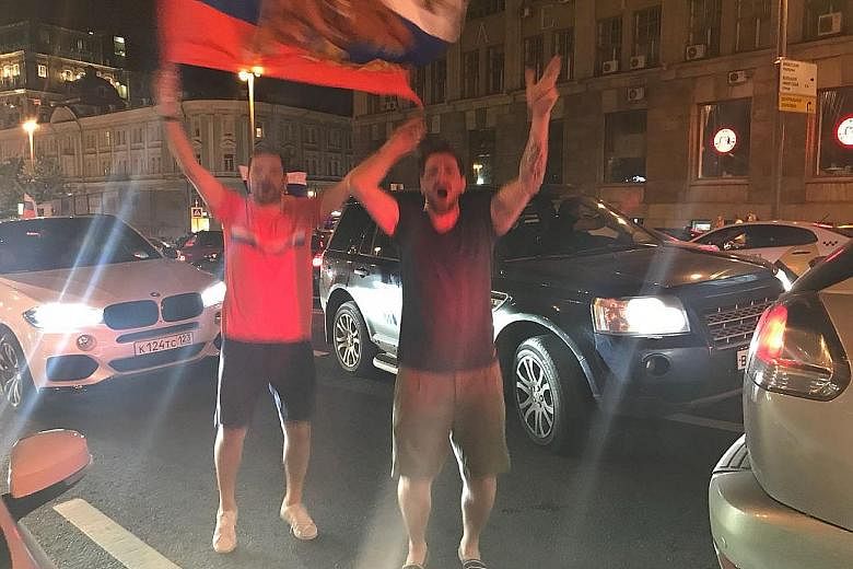 About 50 fans at the Darlingbar in Moscow watching Russia play Egypt. The locals demonstrate their patriotism by bringing flags, standing to attention during their national anthem and shouting "Nujen gol!" (Russian for: We need a goal.); the celebrat