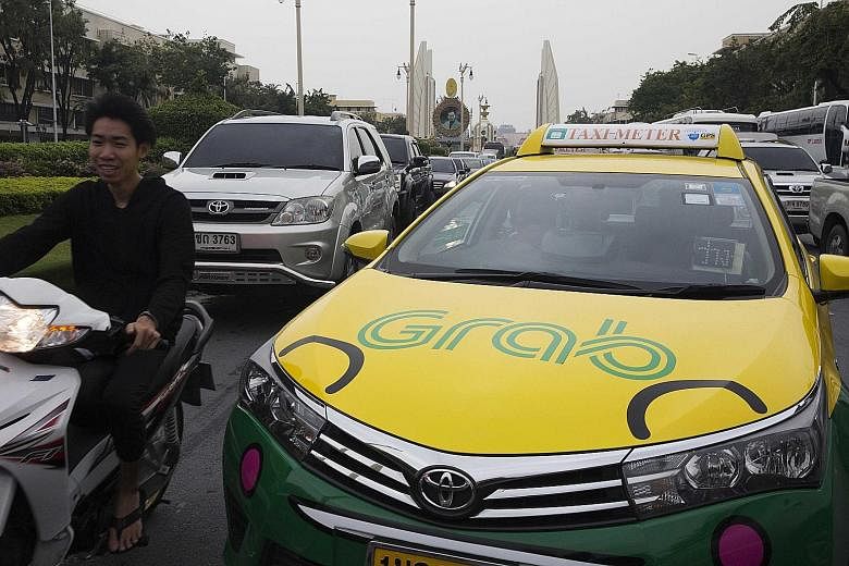 A Grab taxi in Bangkok. The access to data that Grab gets from Toyota's investment will also help Grab maintain efficiency in fleet maintenance as it expands deeper into South-east Asia, where it operates in over 200 cities.