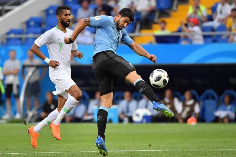 Suarez sends Uruguay into last 16 with hosts Russia