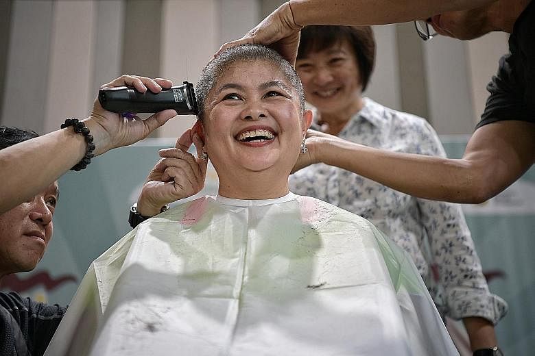 Mrs Josephine Low, corporate operational director of Sunflower Childcare Group, was one of 30 staff members of the childcare company to have their heads shaved in a show of support for young cancer patients. The Children's Cancer Foundation's signatu